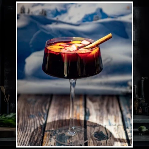 Winter Sangria with cinnamon stick garnish.